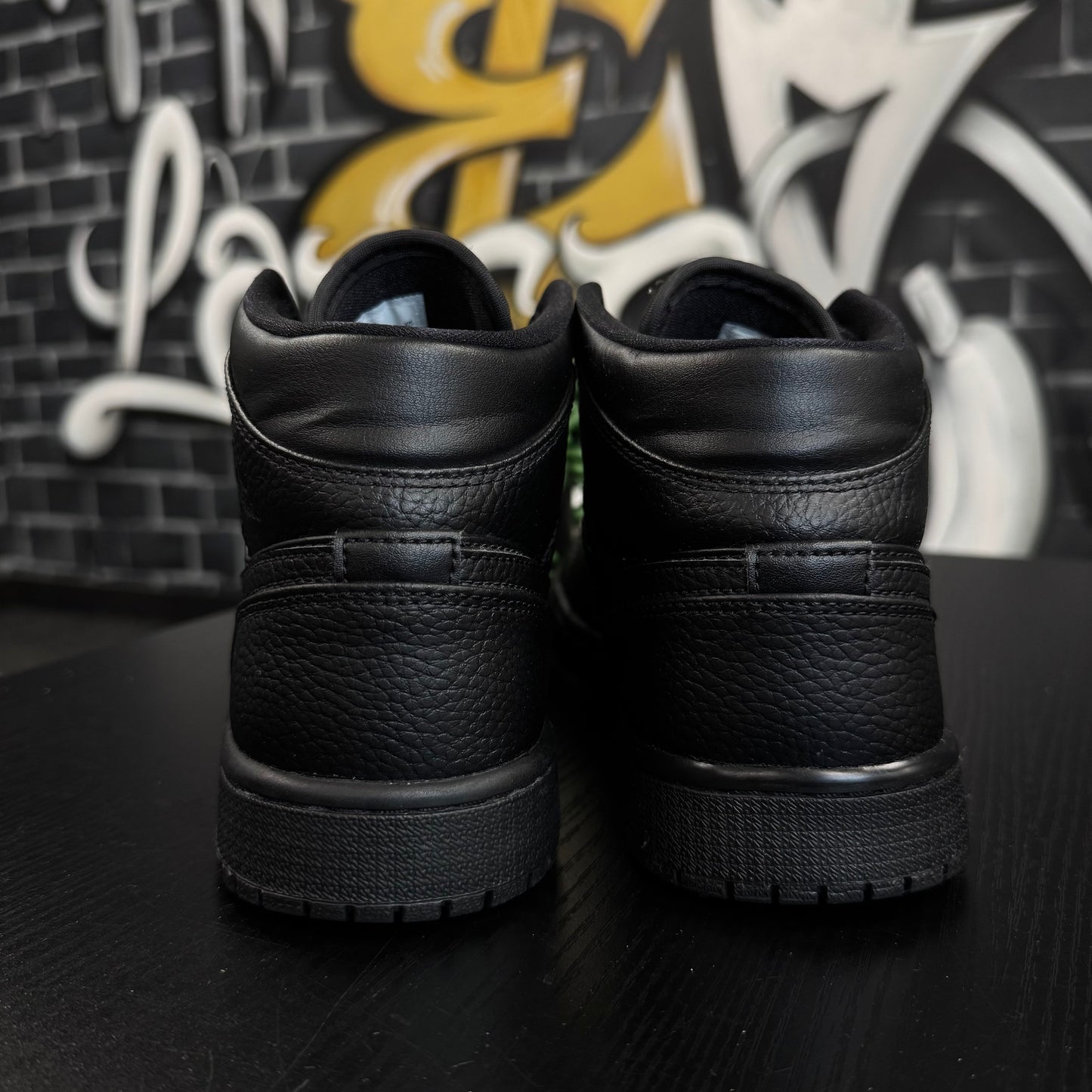 Jordan 1 Mid Triple Black